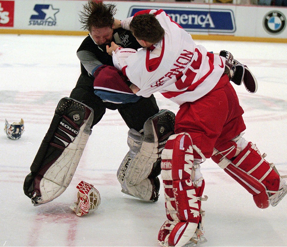 Colorado Avalanche goaltender Patrick Roy, left, takes a punch from Detroit Red Wings' goaltender Mike Vernon during a first-period brawl in Detroit on Wednesday, March 26, 1997. - AP Photo/Tom Pidgeon