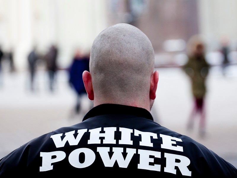 Three members of The Base, a neo-Nazi movement, who have been charged. - Shutterstock.com
