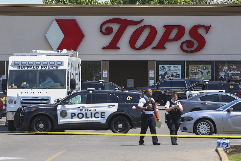 Police outside the Tops grocery store in Buffalo, New York, where a mass shooting occurred on Saturday. - AP PHOTO/JOSHUA BESSEX