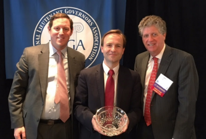 Lt. Gov. Brian Calley poses with public health award from the National Lieutenant Governors Association. - National Lieutenant Governors Association