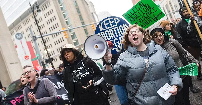 Protesters march in the streets of Detroit the day after a leak draft was published indicating that the U.S. Supreme Court would soon move to overturn Roe v. Wade. - Viola Klocko