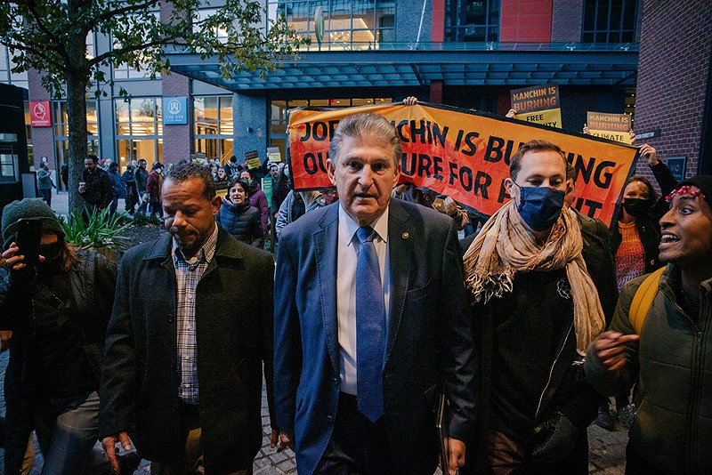 Sen. Joe Manchin confronted by climate activists in 2021. Perhaps they left an impression on him. - Shutterstock