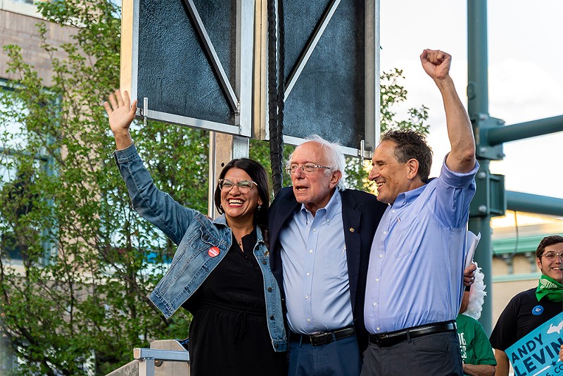 U.S. Sen. Bernie Sanders, center, speaks at a rally on Friday in Pontiac in support of U.S. Reps. Rashida Tlaib, left, and Andy Levin, right. Pro-Israel groups have spent millions to unseat the progressive lawmakers. - Adam Antonich
