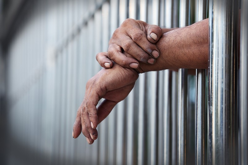 A Michigan House bill would eliminate fees for calling a loved one in jail. - Shutterstock