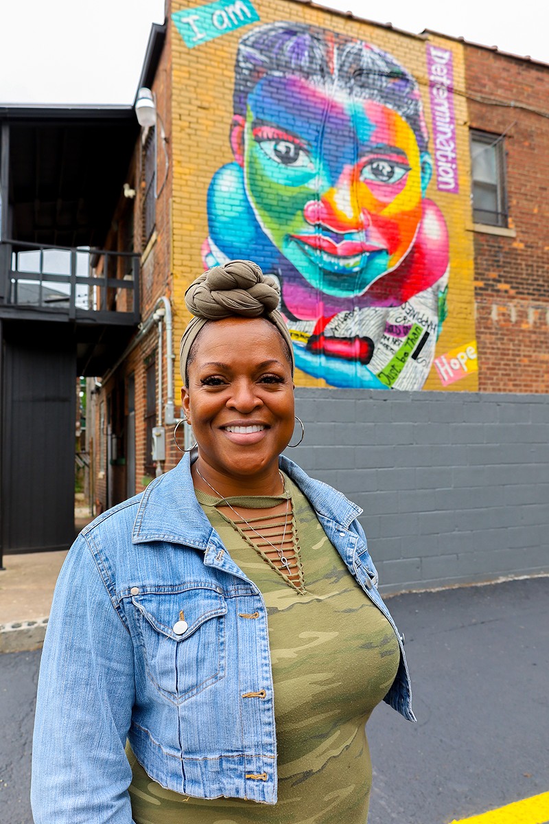 Sonya Greene commissioned a colorful mural on the side of her business to inspire the community. - se7enfifteen