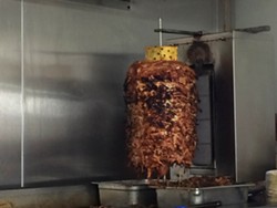 Meat for the tacos al pastor is cooked on a trompo, which is a Mexican spit. - Photo by Tom Perkins