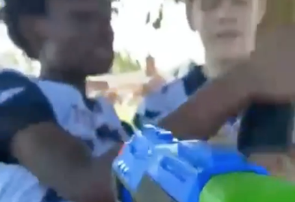 White students point water guns at a Black classmate in a video posted on Instagram and TikTok. - Instagram
