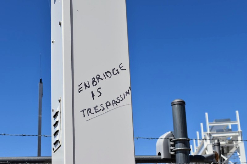 Anti-Line 5 graffiti at Enbridge’s pumping station in Mackinaw City, May 12, 2021. - Laina G. Stebbins