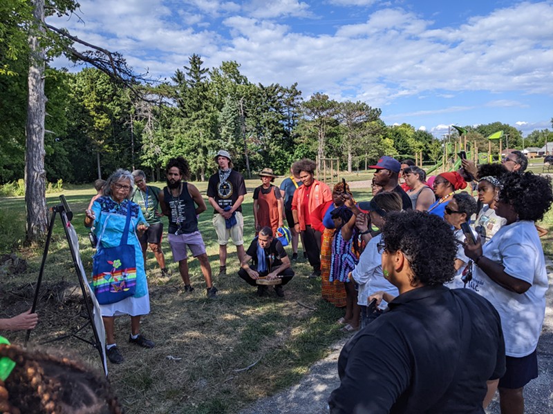 The community gathered during the Ma'iingan Wildwood Trail rededication. Indigenous elder Lucy Harrison (left) led a ceremonial blessing. - Courtesy of Friends of Rouge Park
