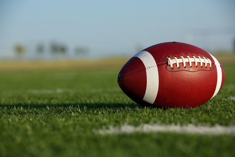 Two Flint-area high schools are severally limiting who can attend their football games. - Shutterstock