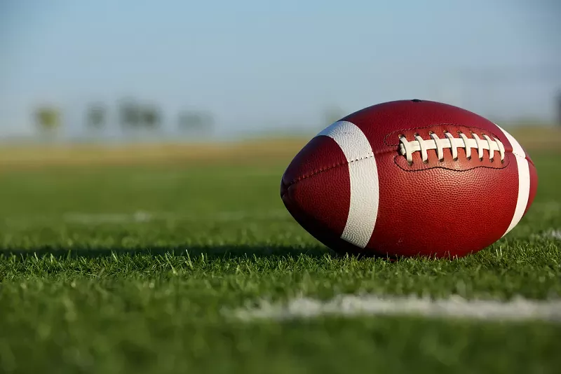 Two Flint-area high schools are severally limiting who can attend their football games. - Shutterstock