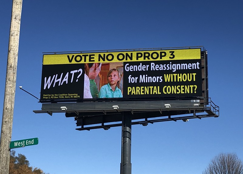A billboard on Eight Mile Road claims Proposal 3 allows for "Sterilization surgery for minors without parental consent." - Lee DeVito