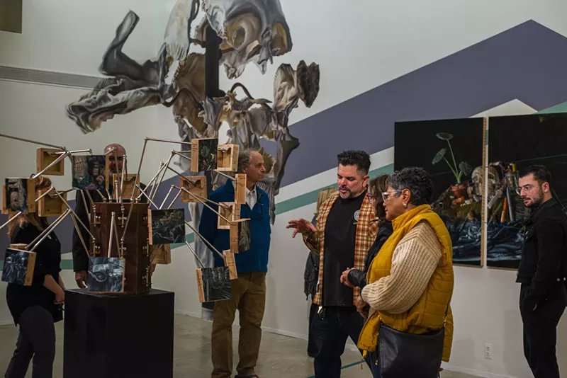 Museum-goers check out Bakpak Durden's The Eye of Horus exhibit. - Sarah Blanchette