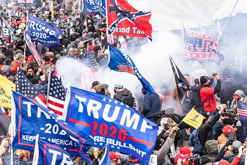 Smoke rises after police used pepper spray against Pro-Trump supporters on Jan. 6, 2021. - lev radin / Shutterstock.com