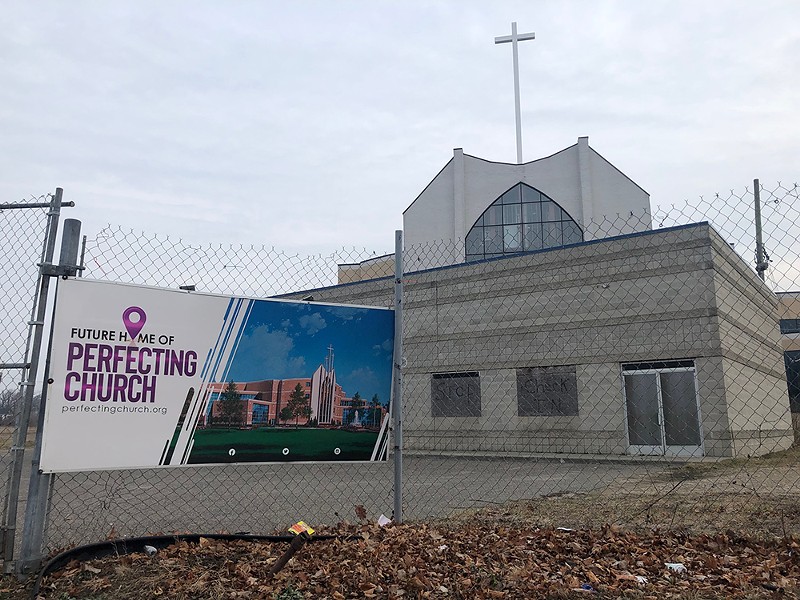 A sign at Detroit’s 20-year Perfecting Church development shows expectations versus reality. - Lee DeVito