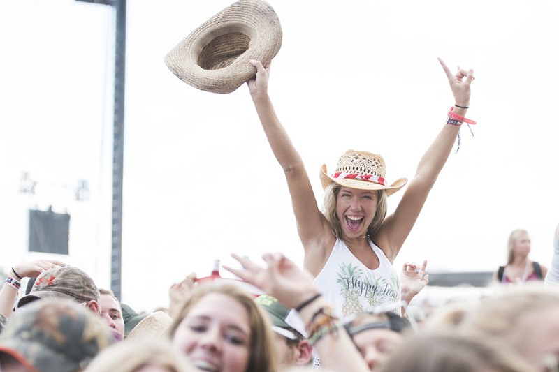 Country music fan Haley Nugent poses in a scene from Faster Horses festival in 2016. - Mike Ferdinande