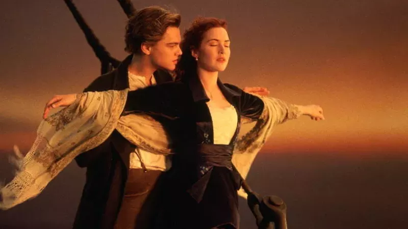 The scene where Jack supports Rose climbing up the ship’s bow is enlivened by their physical chemistry. - 20th Century Studios