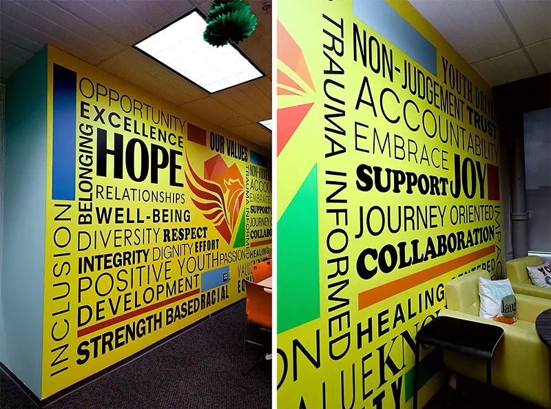 Positive messages are emblazoned across one of the center’s walls. - se7enfifteen