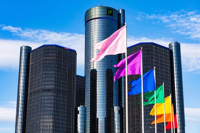 Rainbow flags fly in front of the Detroit’s GM Renaissance Center during Pride Month. - Shutterstock