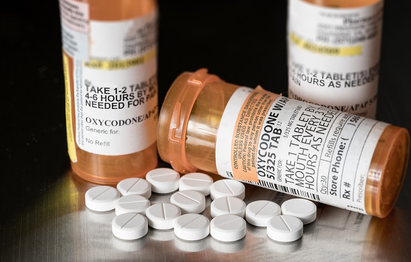 Bottles of opioid pills. - Steve Heap/Shutterstock.com