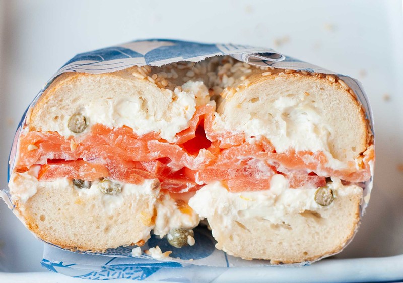 The Lew Silver sandwich includes smoked salmon, lemon zest shmear, red onion, sliced tomato, and tangy capers. - Tom Perkins
