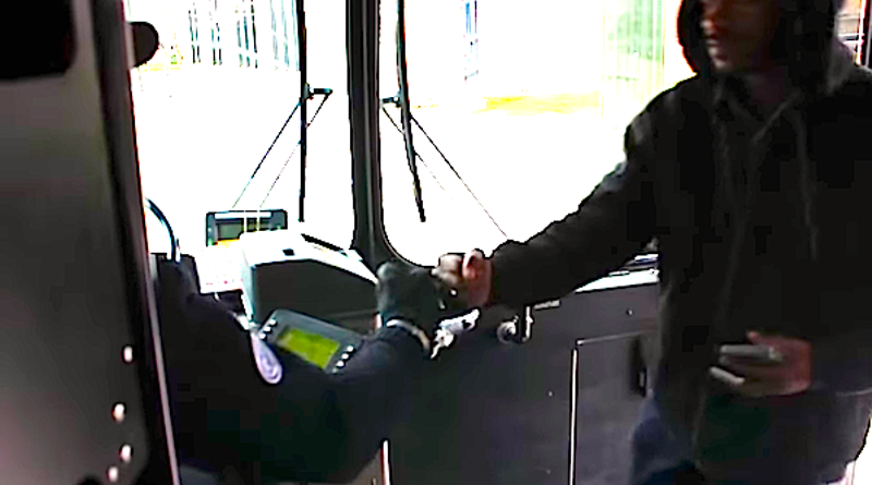 DDOT bus driver Larry Dennis Starkey greets a passenger boarding the 53 Woodward bus. - Freeze-frame from the No Angles video