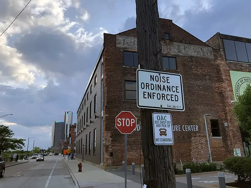 Near Detroit’s Riverwalk, the city recently installed a series of speed bumps near signs that warn drivers “Noise Ordinance Enforced.” - Lee DeVito