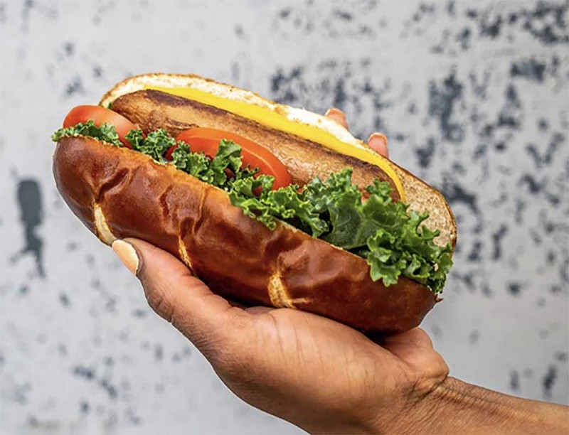 “The 313” is a Beyond sausage topped with kale, tomato, vegan mayo, and mustard on a pretzel bun. - Courtesy photo