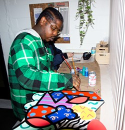 Detroit artist Sheefy McFly working on a project at a previous Art Night. - Woobenz Deriveau