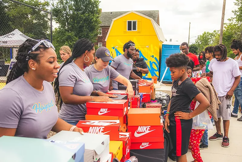 Dozens of donated shoes sit on a table during Hoopfest. - Courtesy of NW Goldberg Cares