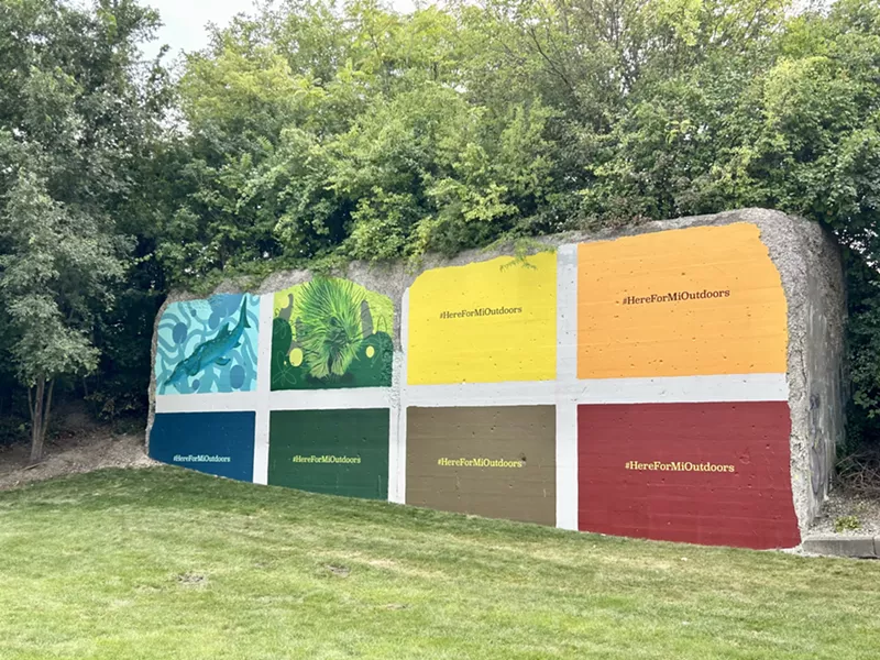 Ed Irmen is painting this mural along the Dequindre Cut. - Steve Neavling