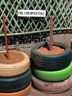 Stacks of tires contain compost made from food scraps. - Whitney Bauck