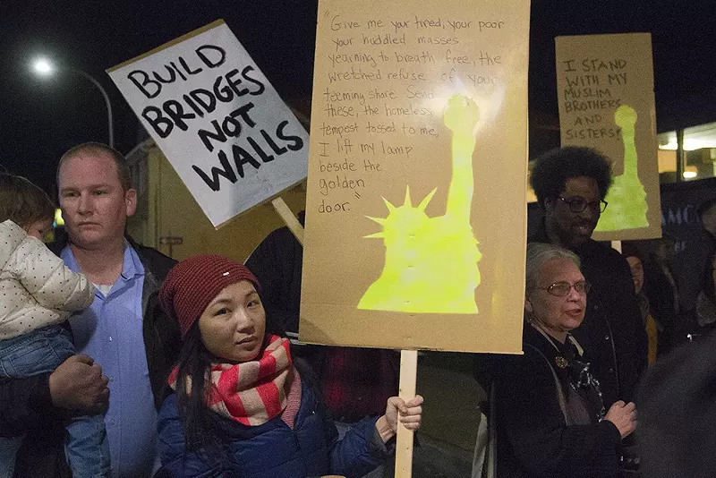 Hamtramck residents — including former Hamtramck mayor Karen Majewski, second from right — protesting the Trump administration Muslim travel ban. - Steve Neavling