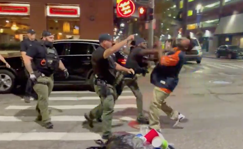 Screenshot of video showing then-Detroit cop Kairy Roberts punching a man in the face in Greektown. - Screenshot