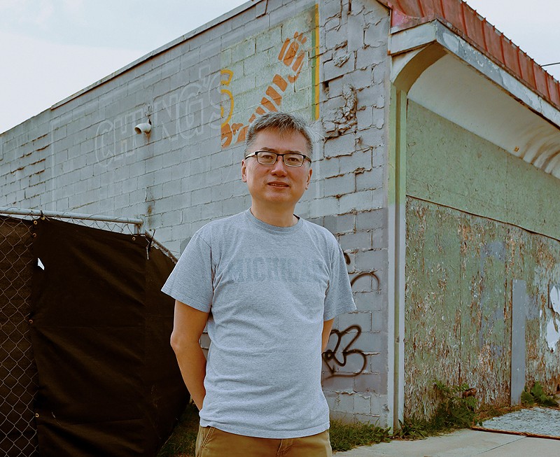 Curtis Chin stands outside his parents’ former Cass Corridor restaurant, Chung’s Cantonese Cuisine. - se7enfifteen