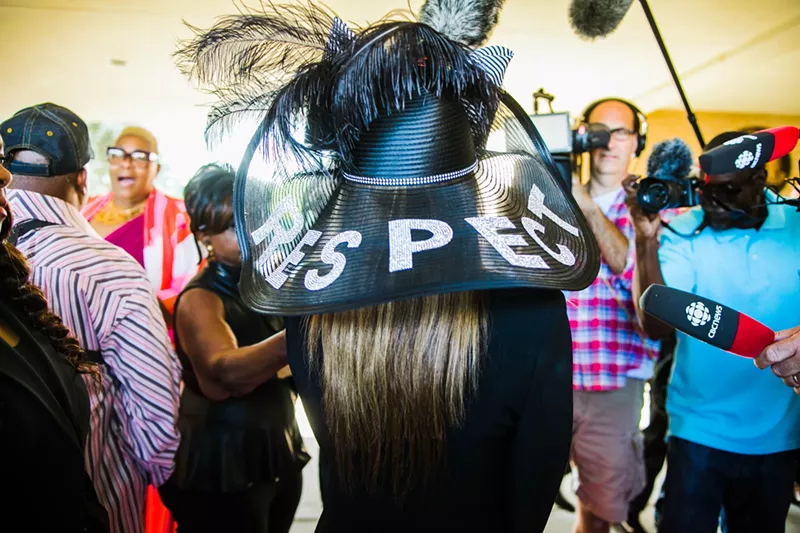 A mourner wears a hat emblazoned with the message “RESPECT” at Aretha Franklin’s funeral. - Courtesy of Cyrus Tetteh