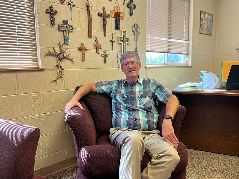 Pastor Bill Uetricht poses for a photograph at First Lutheran Church in Muskegon. The church has a solar array up and running. - Izzy Ross/IPR News
