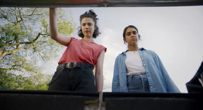 Margaret Qually and Geraldine Viswanathan eye the MacGuffin in the trunk. - Focus Features