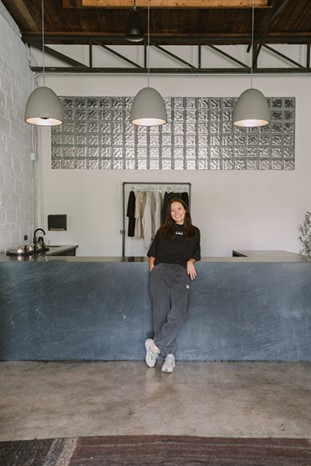 Hot Bones founder Lara Richli stands in front of the studio’s broth bar. - Christina Stoever