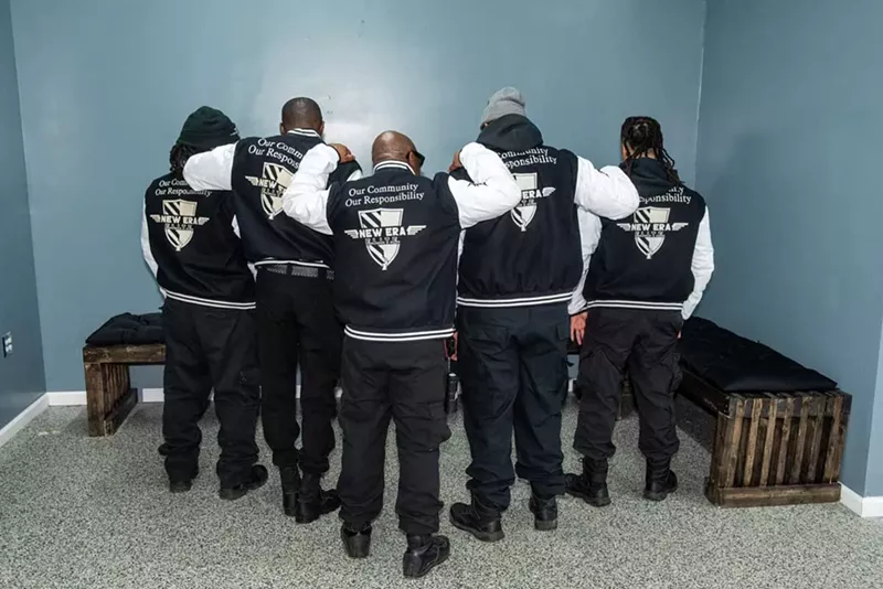 New Era Detroit members wear black varsity jackets with the phrase “Our Community Our Responsibility” stitched on the back. - Kahn Santori Davison