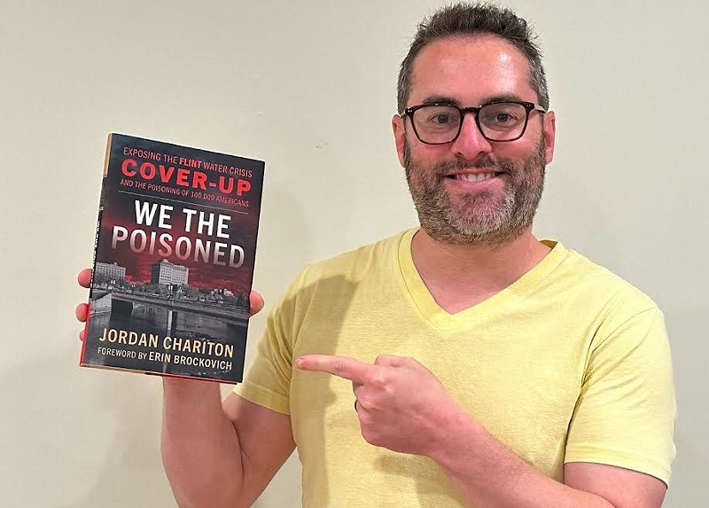 Investigative reporter Jordan Chariton with his new book, We the Poisoned: Exposing the Flint Water Cover-Up and the Poisoning of 100,000 Americans. - Courtesy of Jordan Chariton