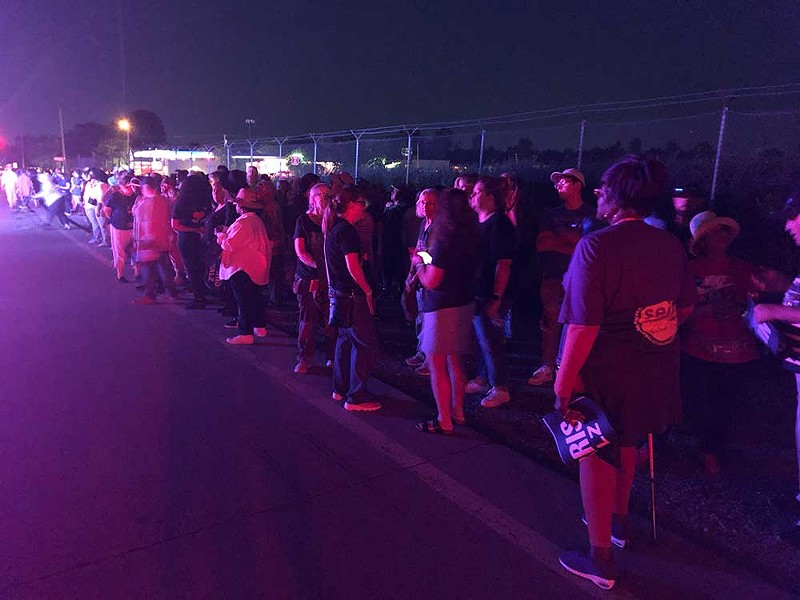 As darkness fell, Harris-Walz supporters were left stranded on the side of the road for hours amid a transportation meltdown. - Lee DeVito