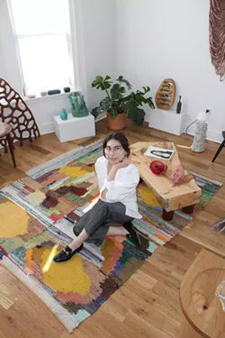 Isabelle Weiss in the private showroom in her home in Little Village, Detroit, surrounded by work from artists and designers connected to Detroit. - Courtesy of the I.M. Weiss Gallery