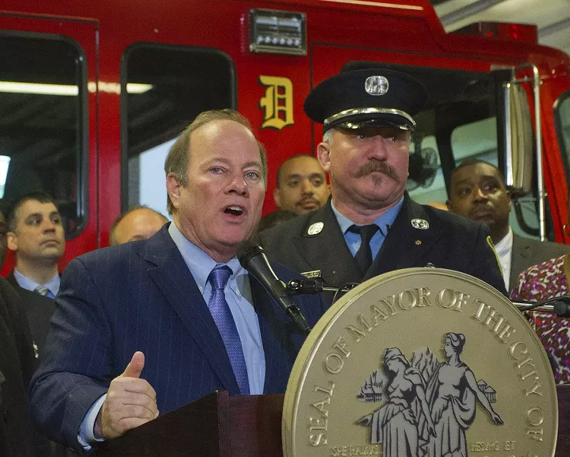 Detroit firefighter Mike Nevin (right) with Mayor Mike Duggan. - Steve Neavling