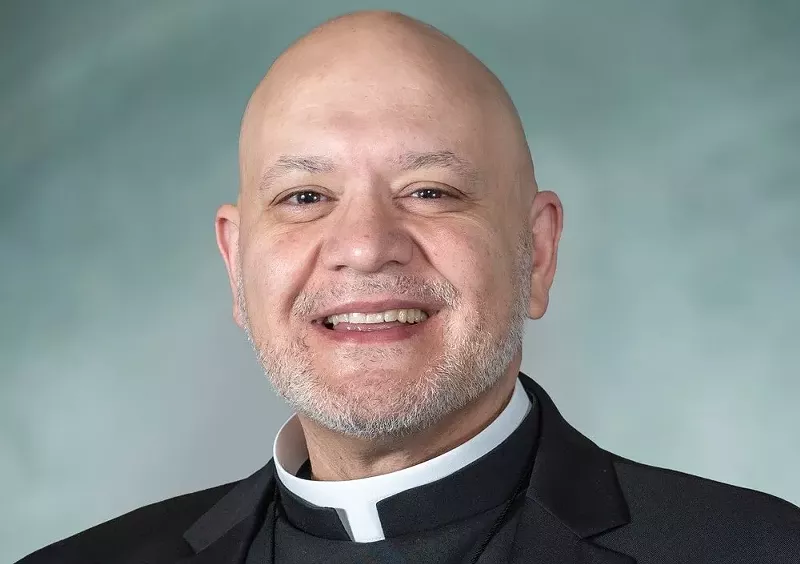 Detroit-based Father Carlos Martins is accused of flossing with a girl’s hair. - Carlos Martins/Facebook