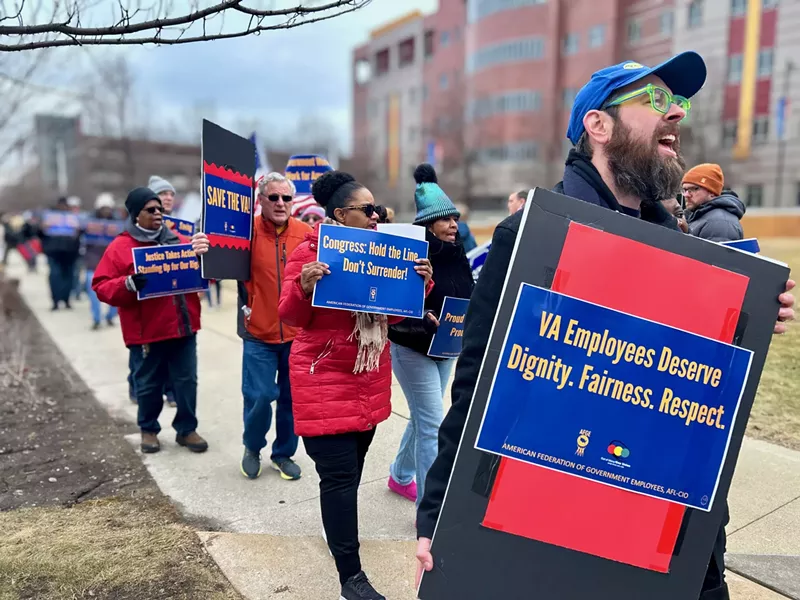 More than 100 federal workers and their allies turned out to protest cuts to veterans' services in Detroit. - Steve Neavling