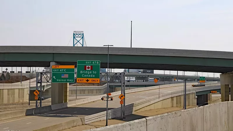 Immigrants are making a wrong turn at the Ambassador Bridge, and many are ending up in federal custody. - Shuttershock