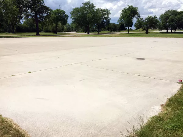 In previous years, Grand Prix organizer Roger Penske's team laid concrete in spots that its vehicles tore up, thus turning parts of the park into parking lots. - Photo by Tom Perkins