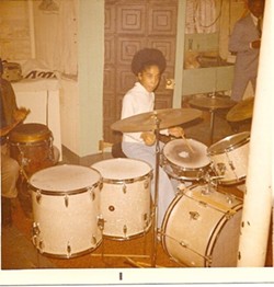 A young Gayelynn McKinney plays the drums. - COURTESY PHOTO