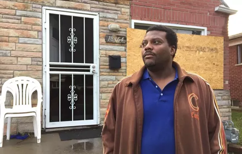 Kevin Dickerson in front of his Detroit home the day after it sold in the Wayne County tax foreclosure auction. - Violet Ikonomova